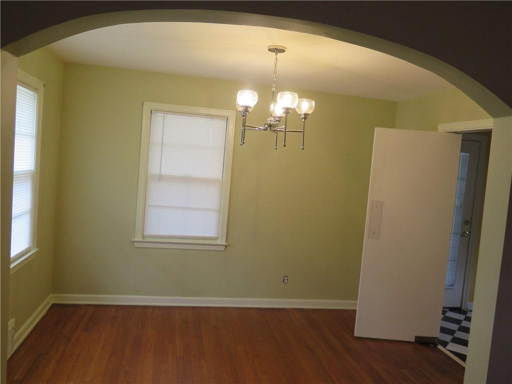 353 Mountain View Drive Northwest Gainesville, GA 30501 - Photo 3 of 8 an empty room with wooden floor and windows