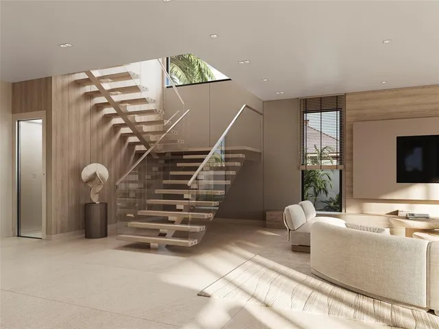 a view of a livingroom with furniture and staircase