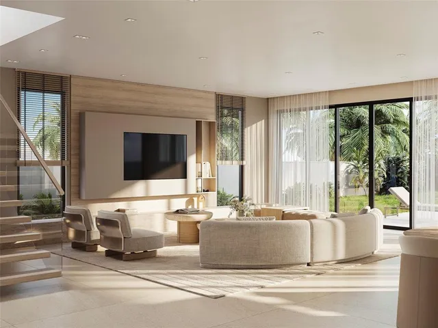 a living room with a large window and a flat screen tv