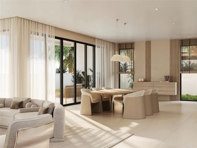 a living room with furniture and large windows