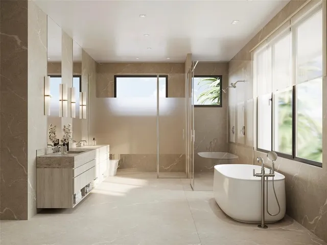 a bathroom with a tub sink and mirror