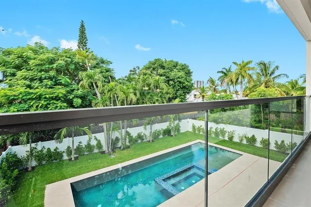 a view of swimming pool from a balcony