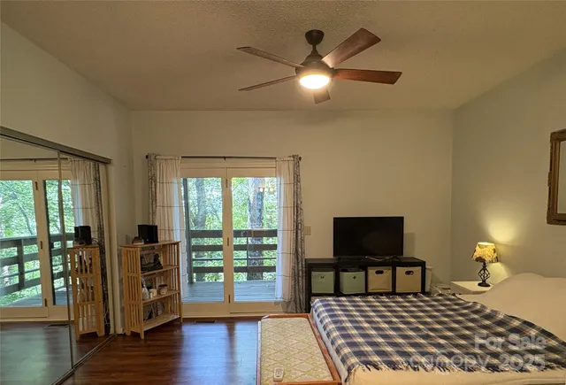 a bedroom with furniture and a window