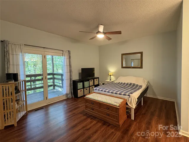 a bedroom with furniture and a window