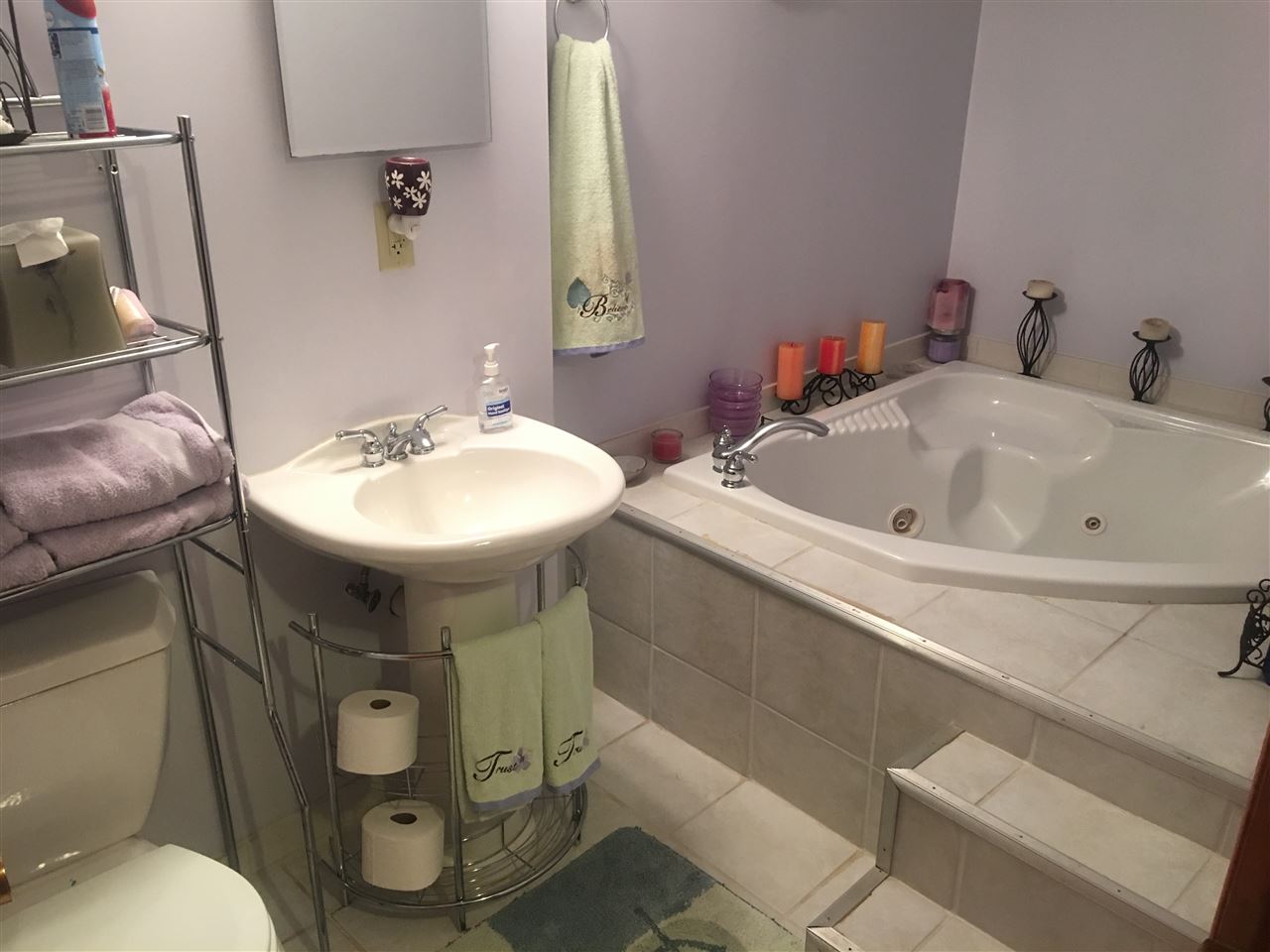 3975 Linden Road Rockford, IL 61109 - Photo 4 of 8 a bathroom with a sink and mirror with toilet