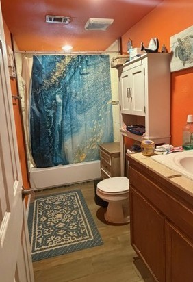 19040 Nottingham Street New Caney, TX 77357 - Photo 5 of 7 a bathroom with a toilet a sink and shower