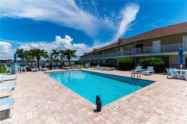a view of a swimming pool with a patio