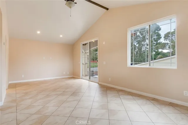 a view of an empty room and a window