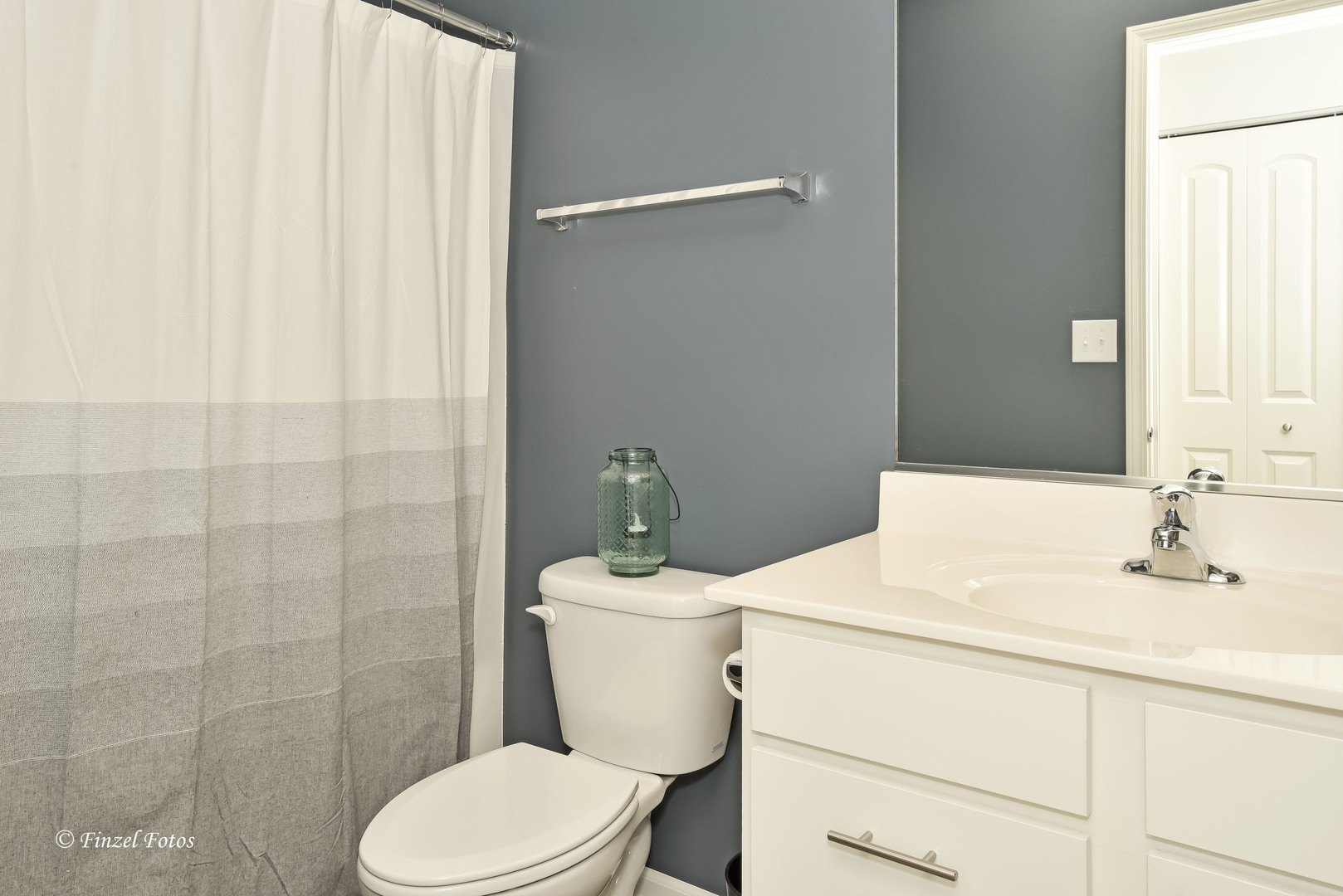 2371 Upland Road Pingree Grove, IL 60140 - Photo 14 of 15 a bathroom with a sink a toilet a mirror and shower curtain