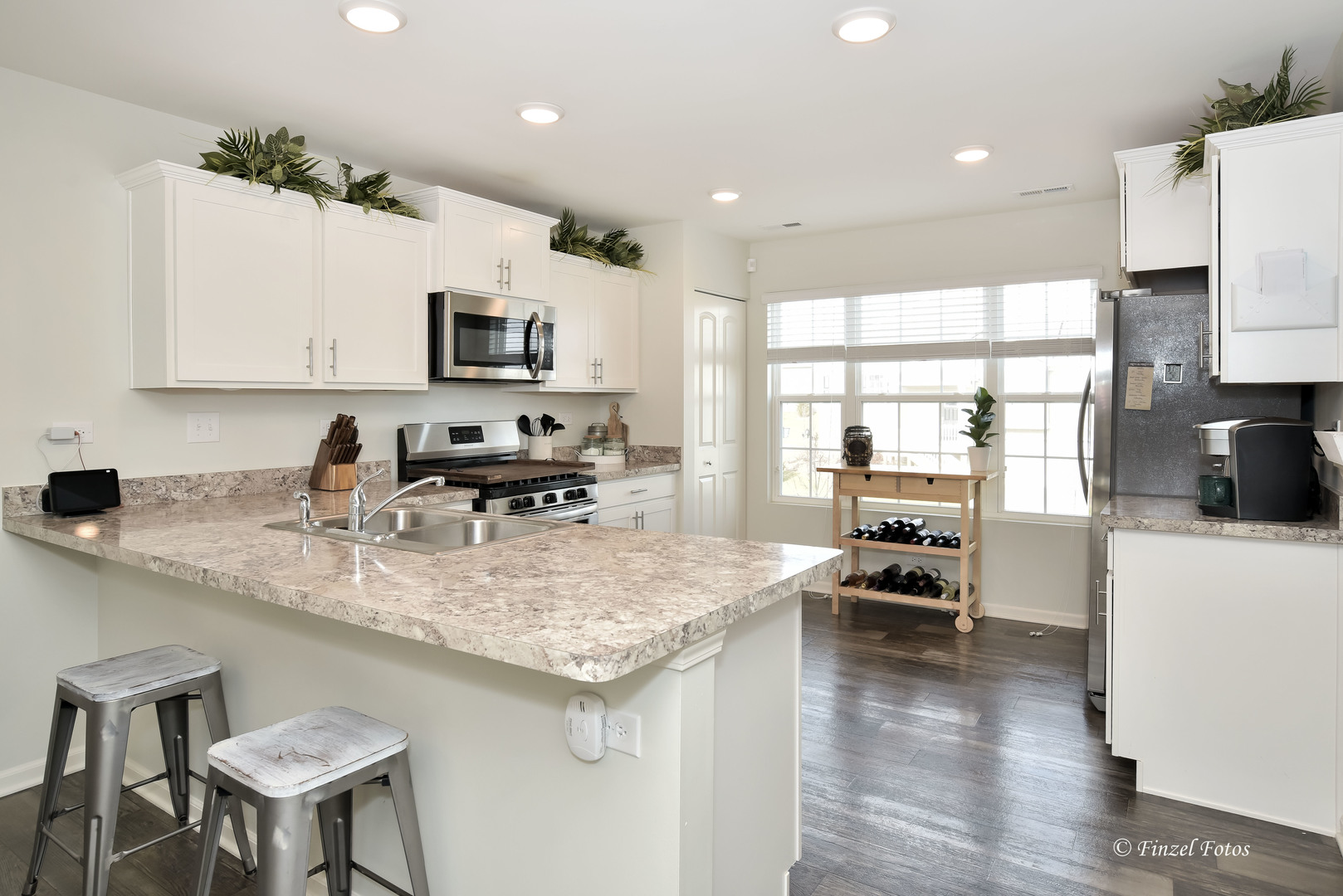 2371 Upland Road Pingree Grove, IL 60140 - Photo 5 of 15 a kitchen with stainless steel appliances granite countertop a sink stove and refrigerator