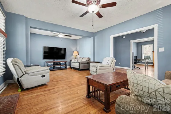 a living room with furniture and a flat screen tv