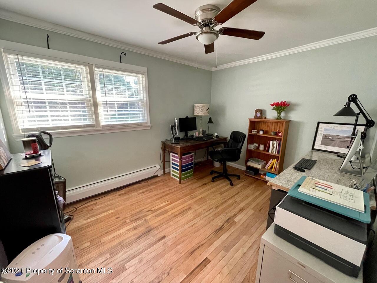 129 State Rte 2023 Forest City, PA 18421 - Photo 11 of 17 a living room with furniture and a wooden floor