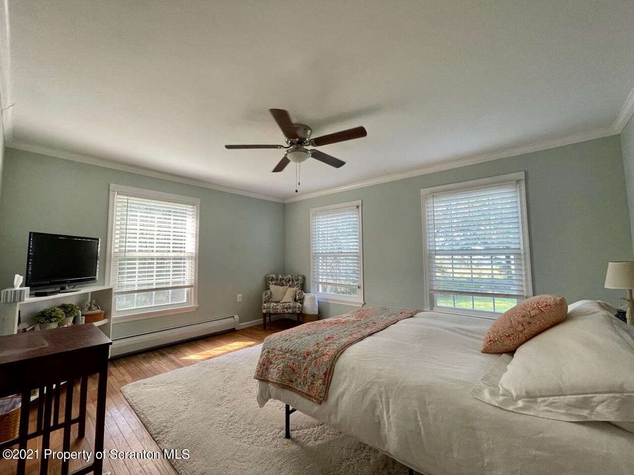129 State Rte 2023 Forest City, PA 18421 - Photo 12 of 17 a bedroom with a bed window and a flat screen tv