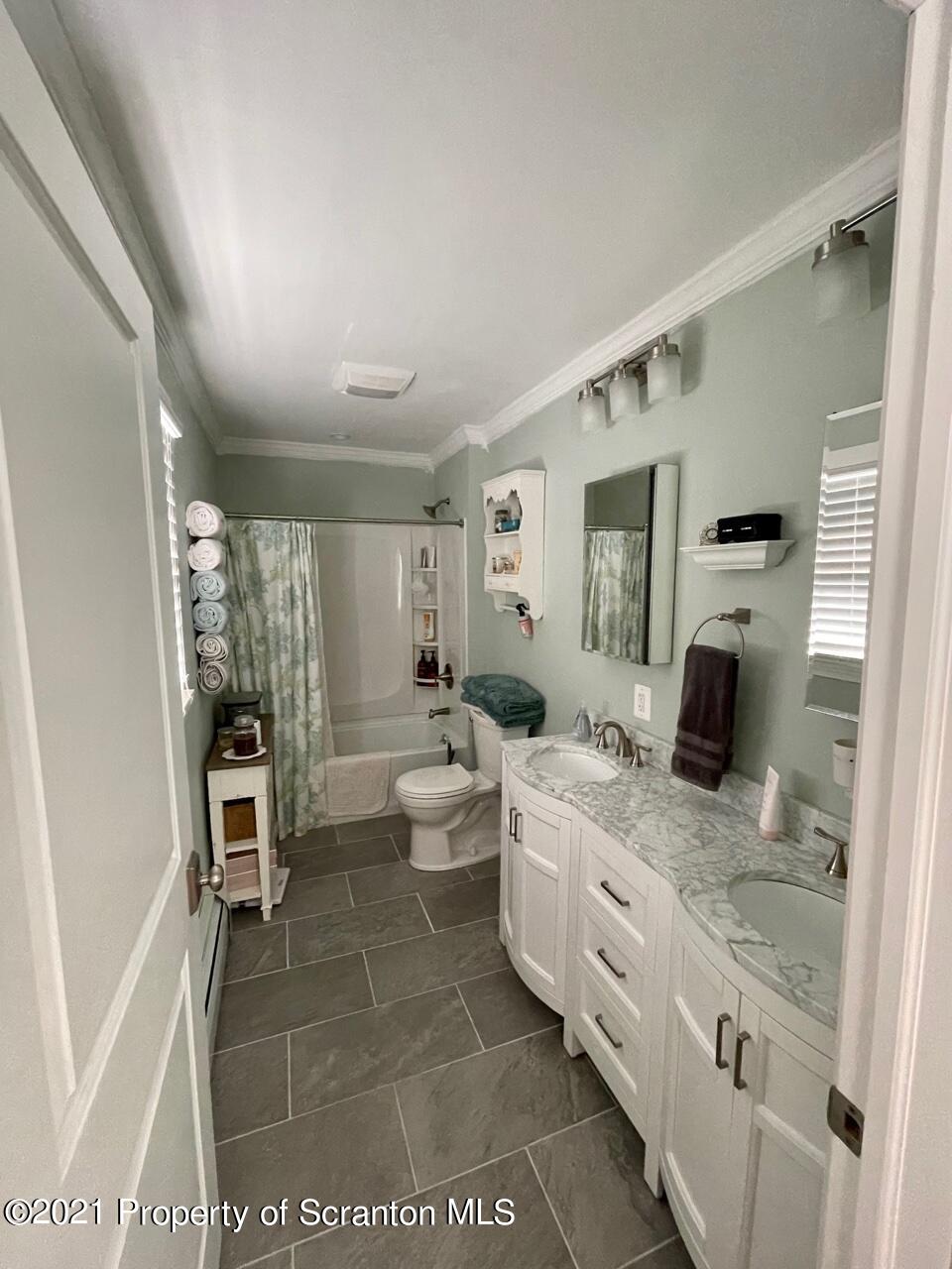 129 State Rte 2023 Forest City, PA 18421 - Photo 14 of 17 a spacious bathroom with a granite countertop sink a toilet and shower