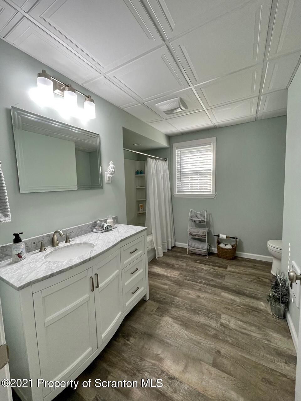 129 State Rte 2023 Forest City, PA 18421 - Photo 15 of 17 a bathroom with a sink double vanity and a mirror