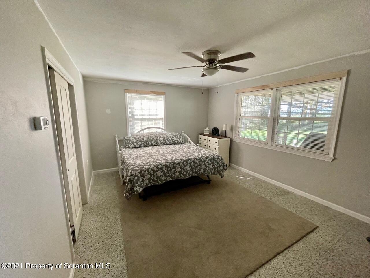 129 State Rte 2023 Forest City, PA 18421 - Photo 16 of 17 a bedroom with a bed dresser and a window