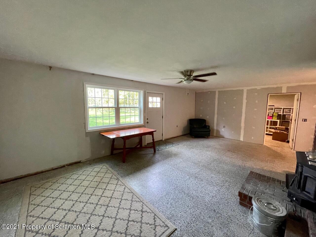 129 State Rte 2023 Forest City, PA 18421 - Photo 17 of 17 a living room with furniture and a window