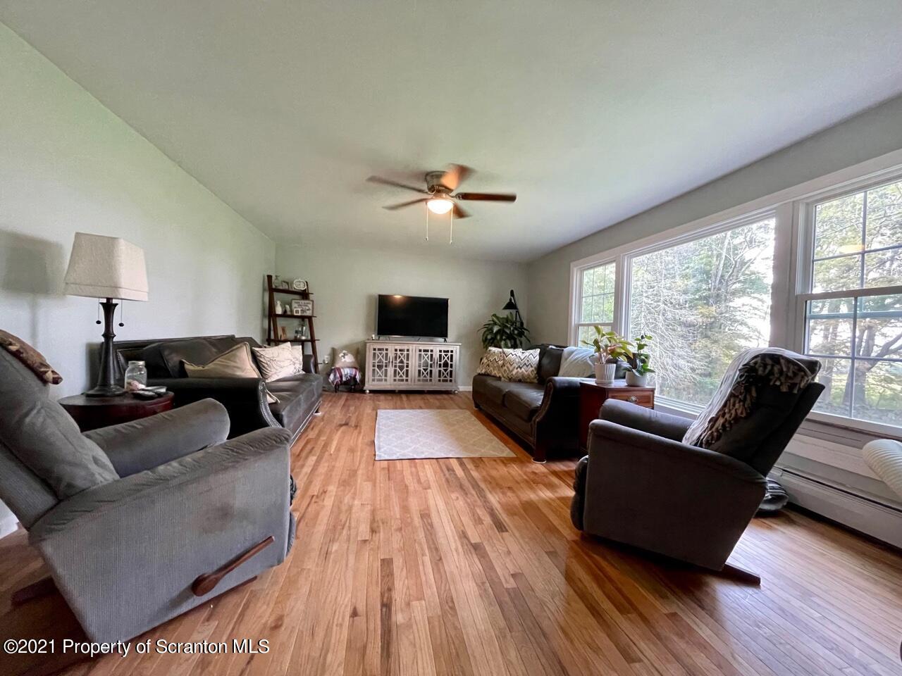 129 State Rte 2023 Forest City, PA 18421 - Photo 5 of 17 a living room with furniture and a large window
