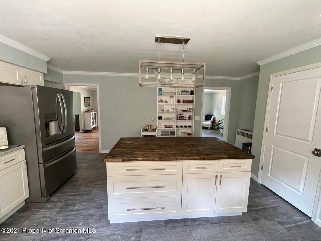 129 State Rte 2023 Forest City, PA 18421 - Photo 7 of 17 a kitchen with granite countertop a refrigerator and a stove