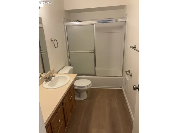 a view of a big room with closet and windows