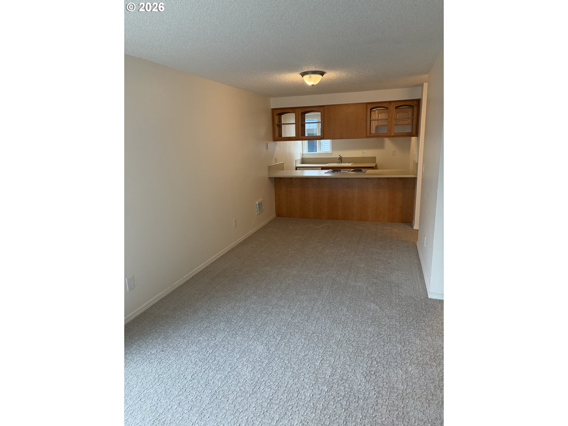 732 Southeast Rene Avenue Gresham, OR 97080 - Photo 5 of 21 a kitchen with refrigerator and cabinets