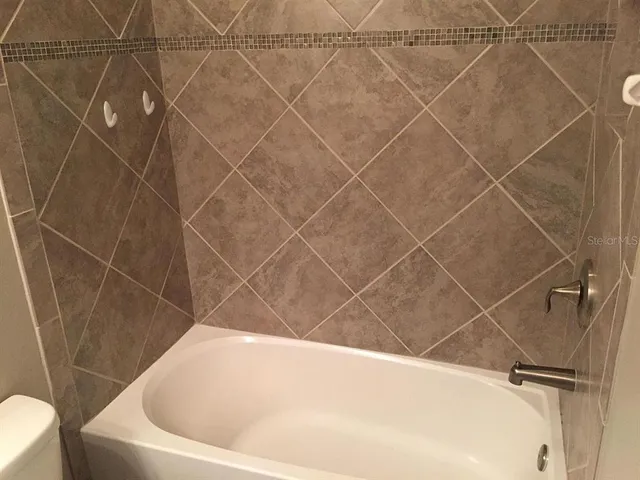 a view of a balcony with a tree