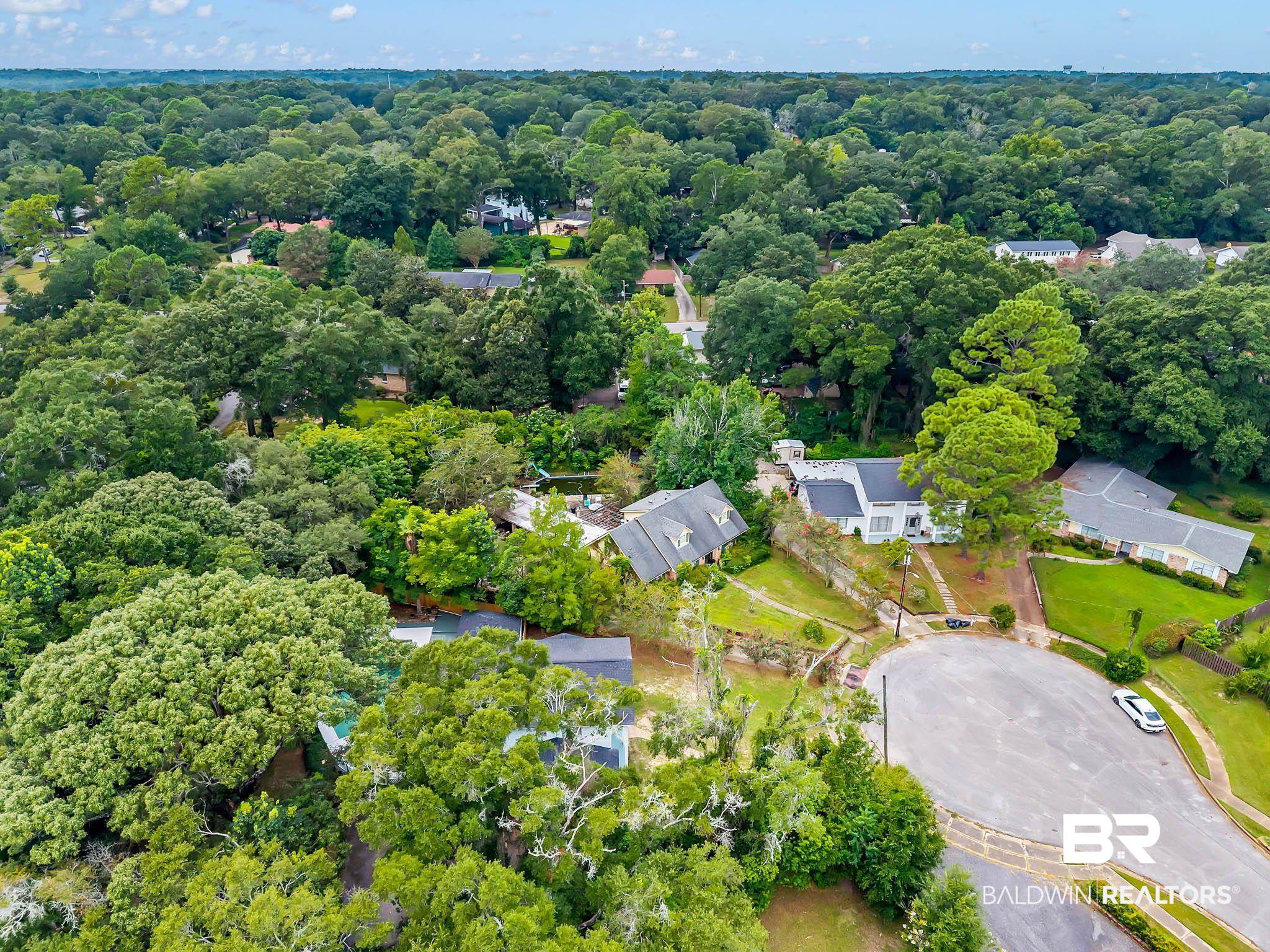 4705 Sherry Court Mobile, AL 36693 - Photo 86 of 100 Aerial view of residential area featuring a heavily wooded area