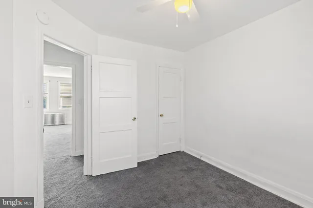 an empty room with a bathroom