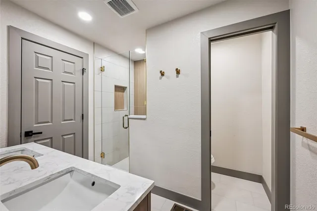 a bed room with bed and a television