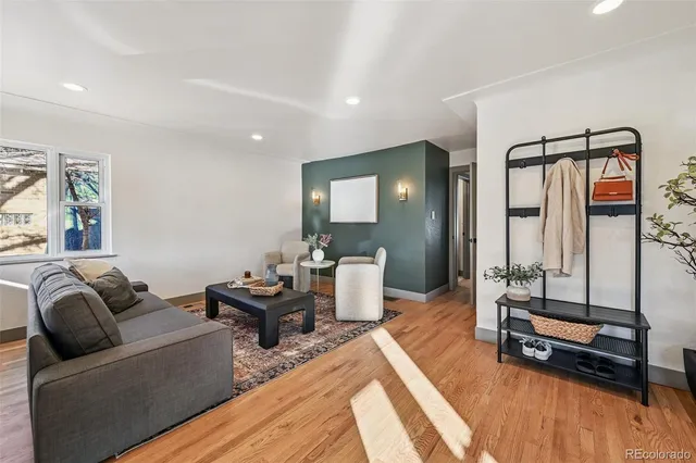a living room with furniture and a rug