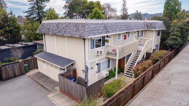a aerial view of a house with a yard and roof