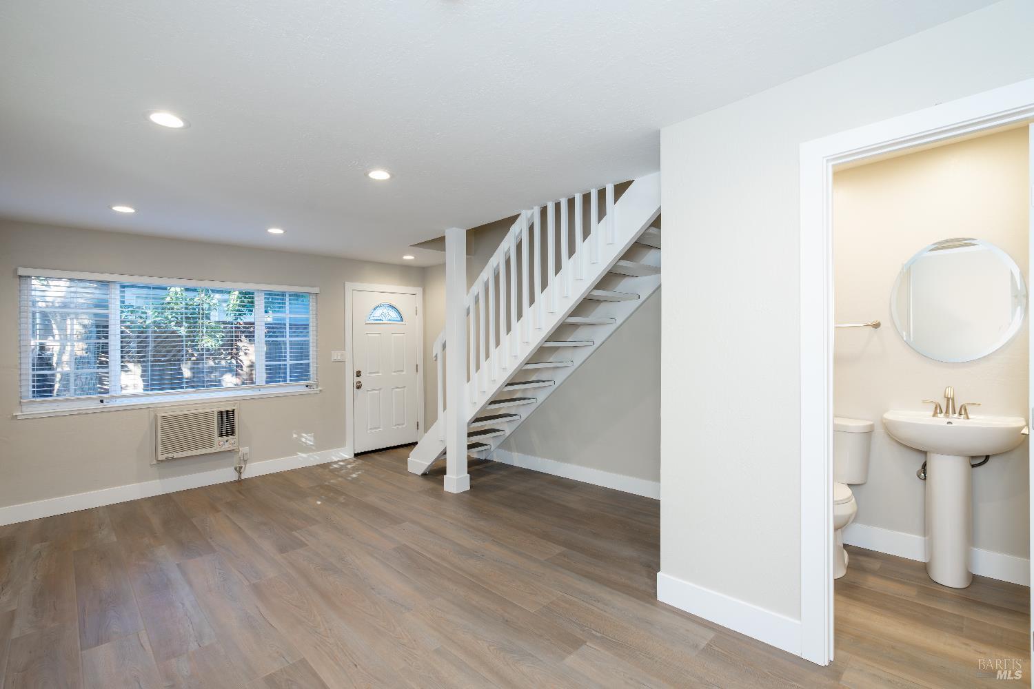 37 Pacheco Street San Rafael, CA 94901 - Photo 11 of 24 wooden floor in an empty room with a window