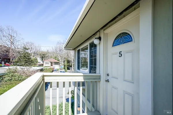 a large kitchen with stainless steel appliances granite countertop a stove and a refrigerator