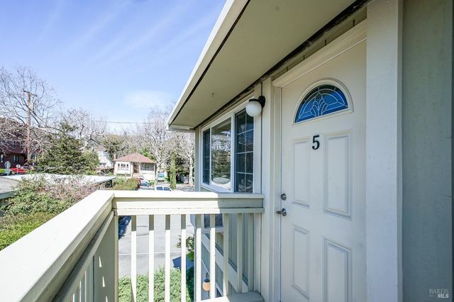 a large kitchen with stainless steel appliances granite countertop a stove and a refrigerator
