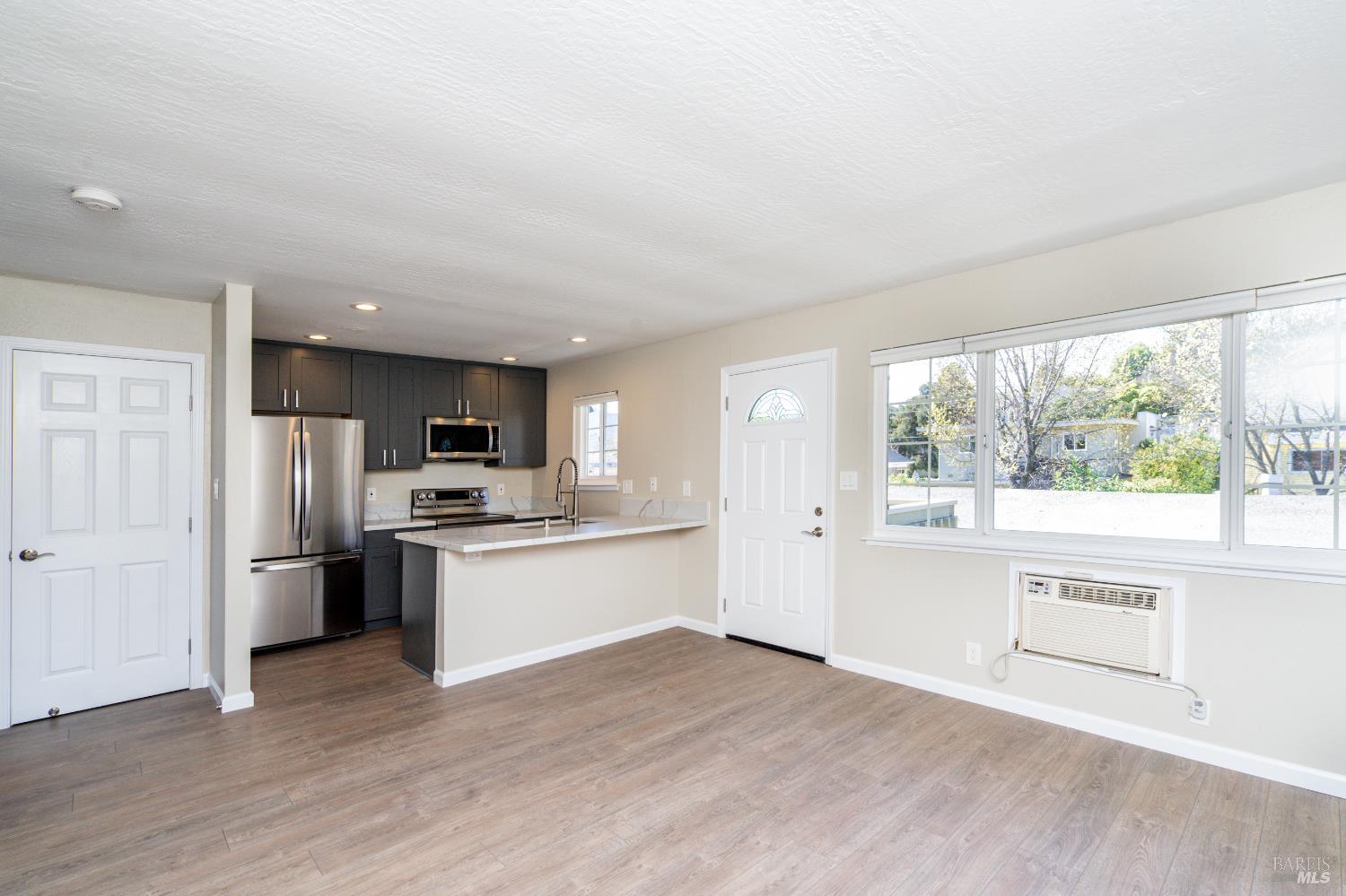 37 Pacheco Street San Rafael, CA 94901 - Photo 15 of 24 a large kitchen with stainless steel appliances granite countertop a stove and a refrigerator