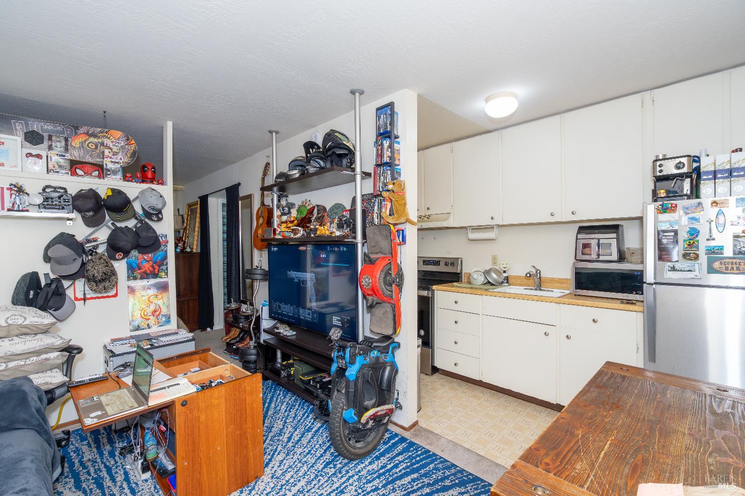 37 Pacheco Street San Rafael, CA 94901 - Photo 18 of 24 a view of a kitchen with fridge and workspace