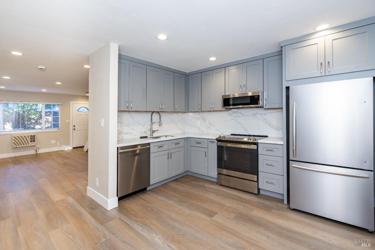 37 Pacheco Street San Rafael, CA 94901 - Photo 2 of 24 a kitchen with a refrigerator and a stove top oven