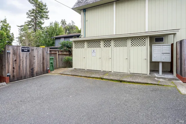 a room with a clock and cabinets