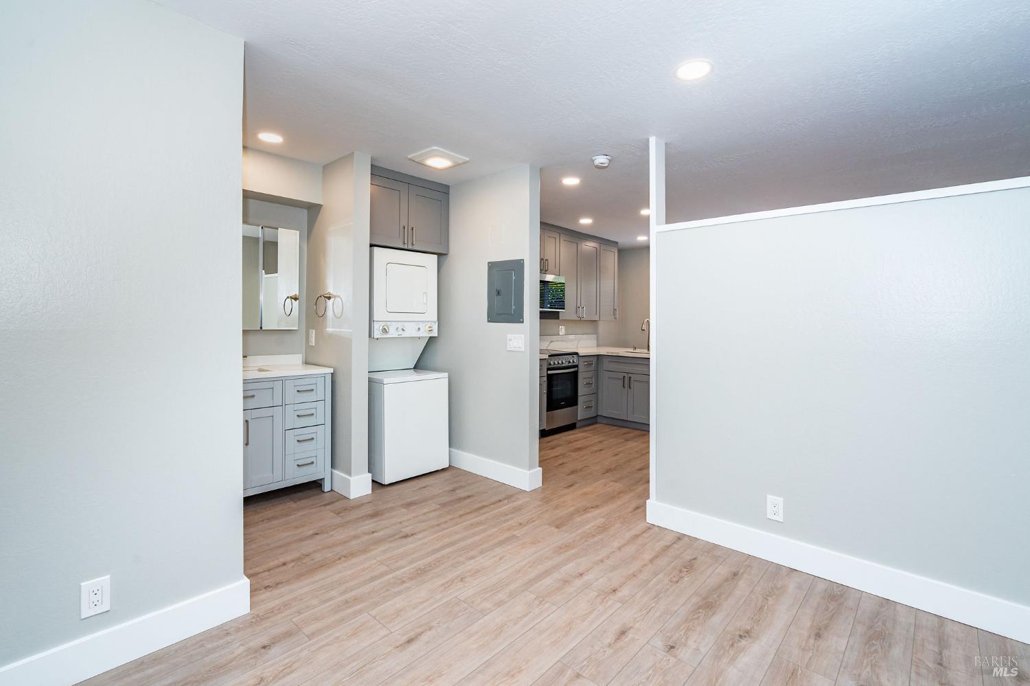 37 Pacheco Street San Rafael, CA 94901 - Photo 8 of 24 a kitchen with stainless steel appliances a refrigerator and wooden floor