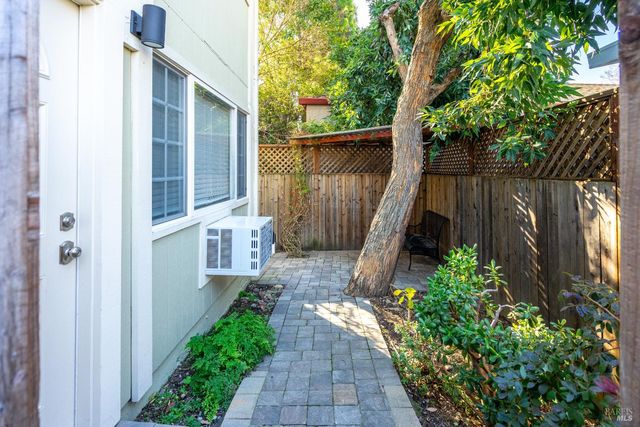 a view of entryway with wooden floor and stairs