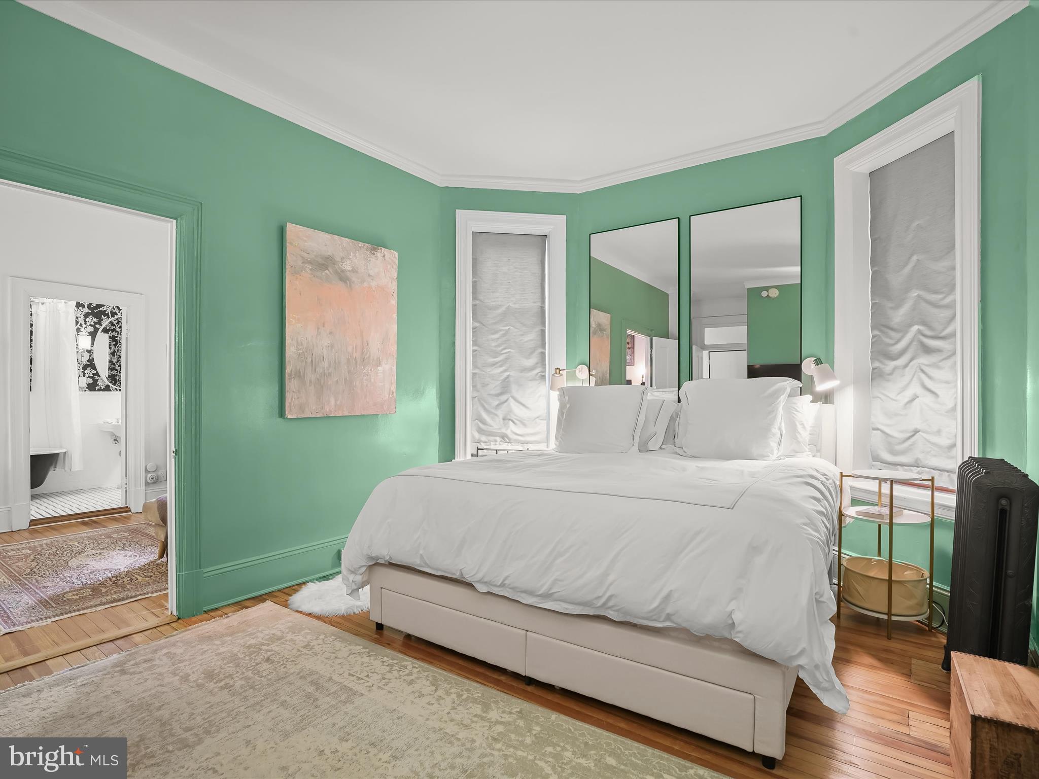 2220 20th Street Northwest, Unit 46 Washington, DC 20009 - Photo 13 of 27 a bedroom with a bed and a large mirror