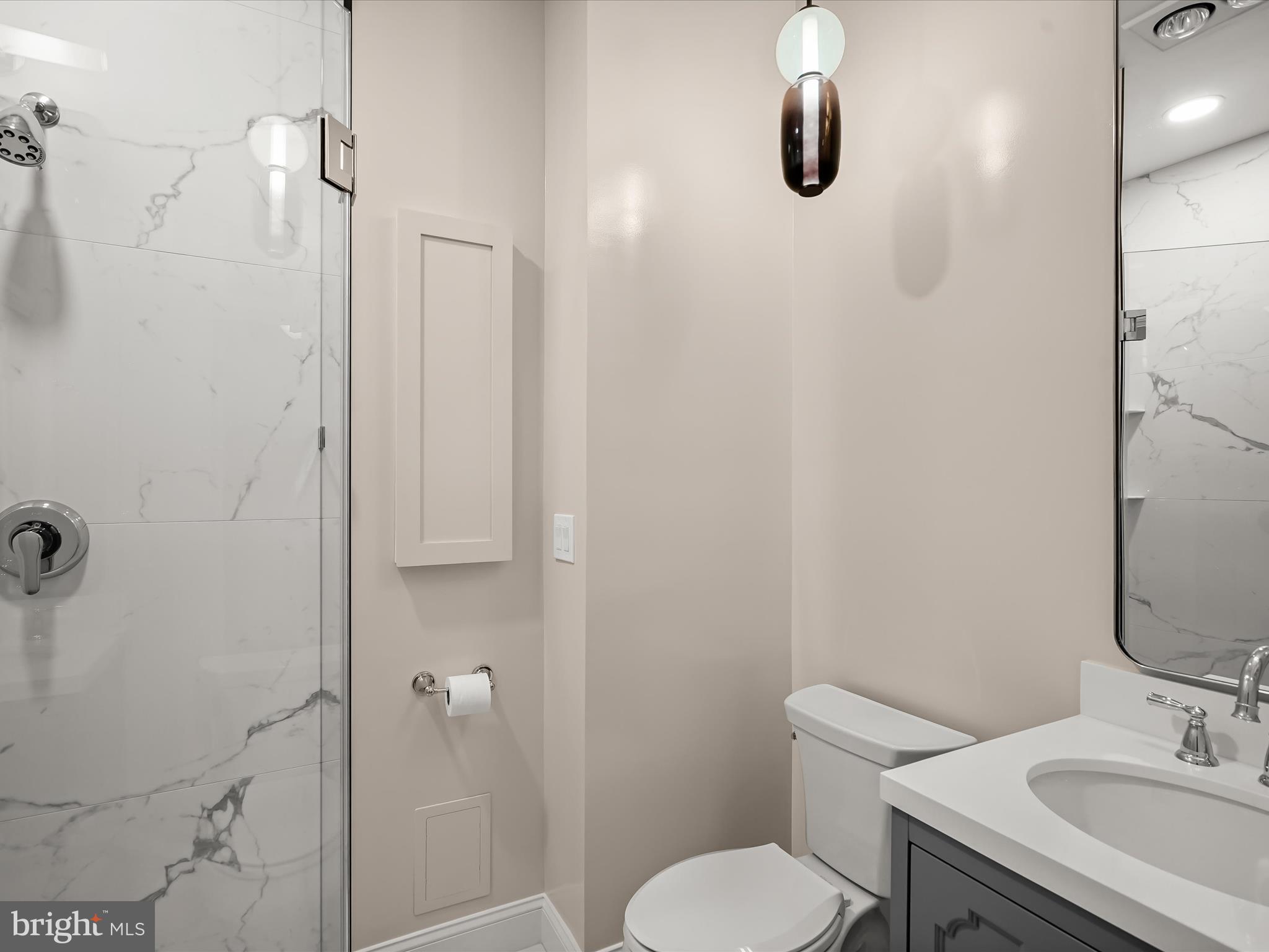 2220 20th Street Northwest, Unit 46 Washington, DC 20009 - Photo 21 of 27 a bathroom with a toilet sink and shower