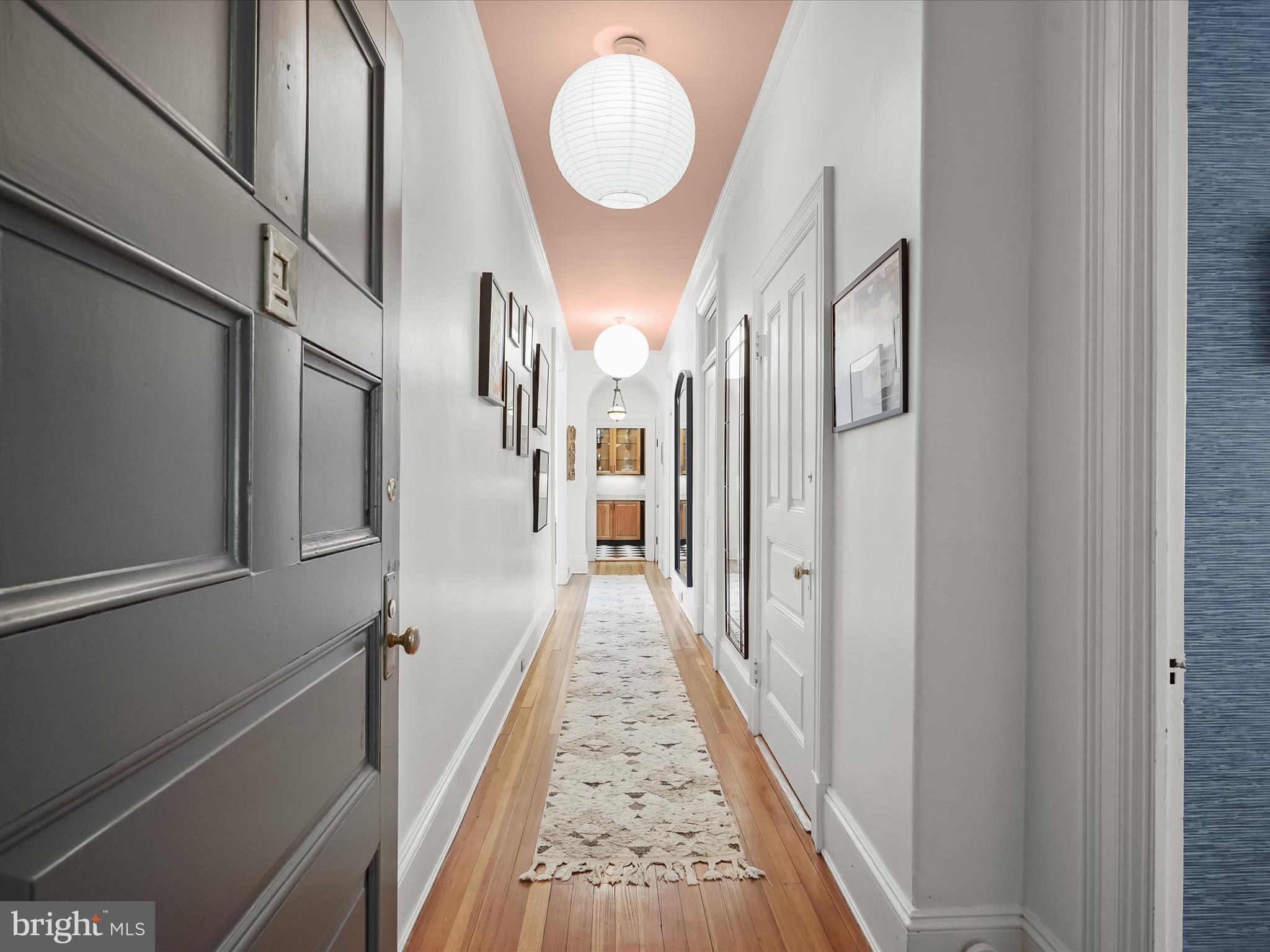 2220 20th Street Northwest, Unit 46 Washington, DC 20009 - Photo 23 of 27 a view of a hallway with wooden floor and staircase