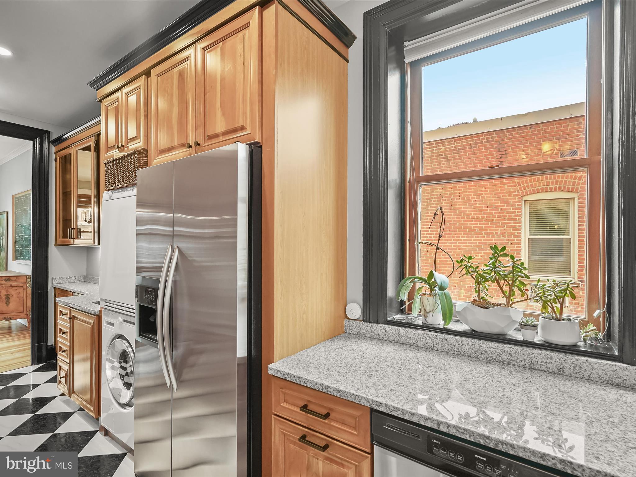 2220 20th Street Northwest, Unit 46 Washington, DC 20009 - Photo 10 of 27 a kitchen with stainless steel appliances granite countertop a refrigerator and a sink
