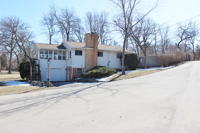 28621 Valley Road Ingleside, IL 60041 - Photo 1 of 24 a street view with residential house