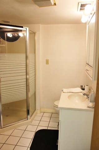 28621 Valley Road Ingleside, IL 60041 - Photo 21 of 24 a bathroom with a sink and a mirror