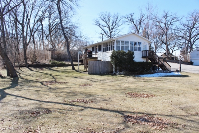 28621 Valley Road Ingleside, IL 60041 - Photo 3 of 24 a view of swimming pool with outdoor seating and trees