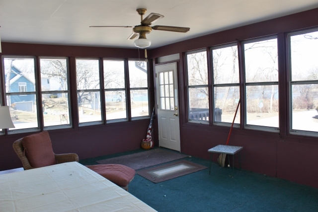 28621 Valley Road Ingleside, IL 60041 - Photo 4 of 24 a living room with furniture and a floor to ceiling window