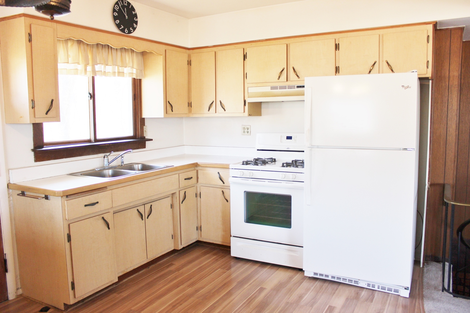 28621 Valley Road Ingleside, IL 60041 - Photo 7 of 24 a kitchen with a white cabinets and white appliances