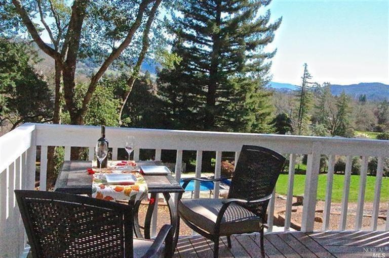 3353 Brush Creek Road Santa Rosa, CA 95404 - Photo 1 of 1 a roof deck with table and chairs a barbeque with wooden floor and fence